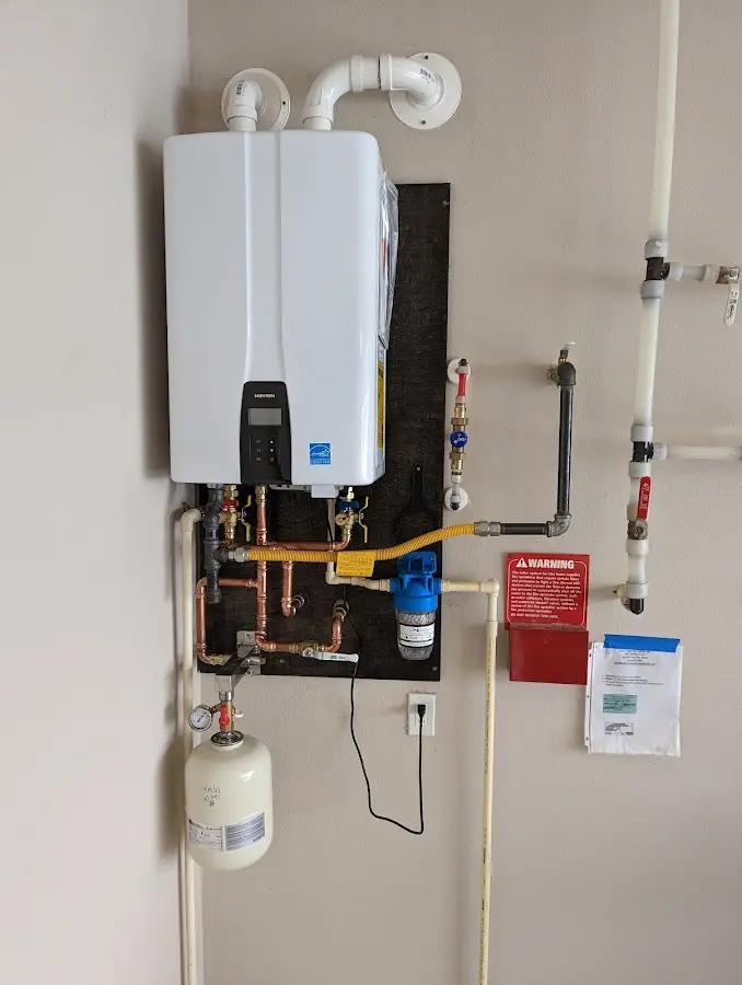 Professional plumber installing copper piping in a Desert Aire home